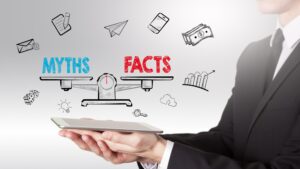 12 myths of call center outsourcing services: A person holding a scale of myths and facts.